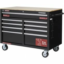 Best Sale ๐ฅฐ Husky 46 in. W x 24.5 in. D Standard Duty 9-Drawer Mobile Workbench Tool Chest with Solid Wood Top in Gloss Black ๐ฅ 29 Best Sale ๐ฅฐ Husky 46 in. W x 24.5 in. D Standard Duty 9-Drawer Mobile Workbench Tool Chest with Solid Wood Top in Gloss Black ๐ฅ -Deals Tool Storage Store gloss black with silver trim husky mobile workbenches h46mwc9v2 76 1000